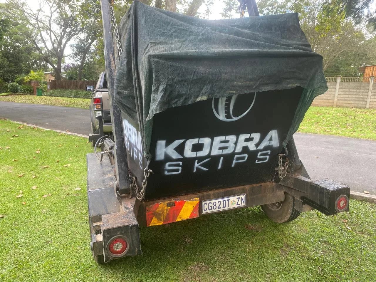 Rear of the Kobra Skips trailer on the road — out on a run in the Upper Highway area.